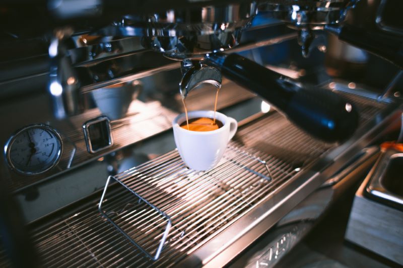 Espresso Coffee Machine with a Cup of Coffee